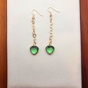 Dangling earrings with green hearts 💚